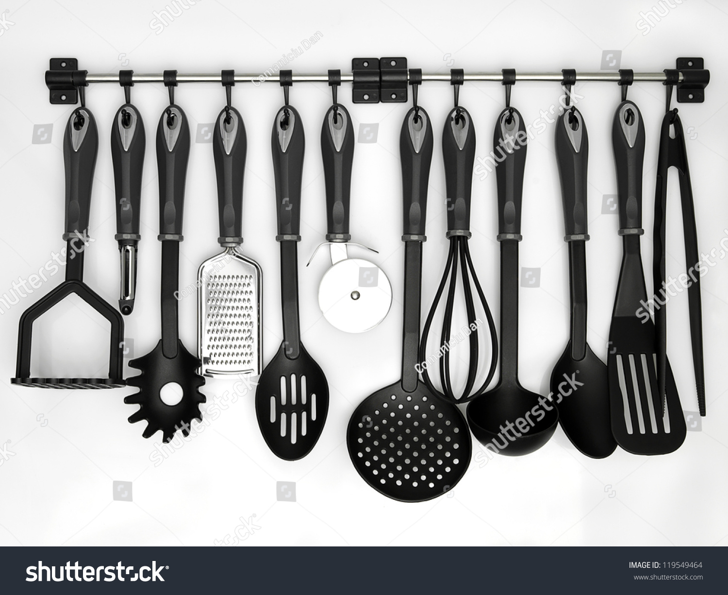 stock-photo-kitchen-utensils-hanging-white-background-119549464.jpg